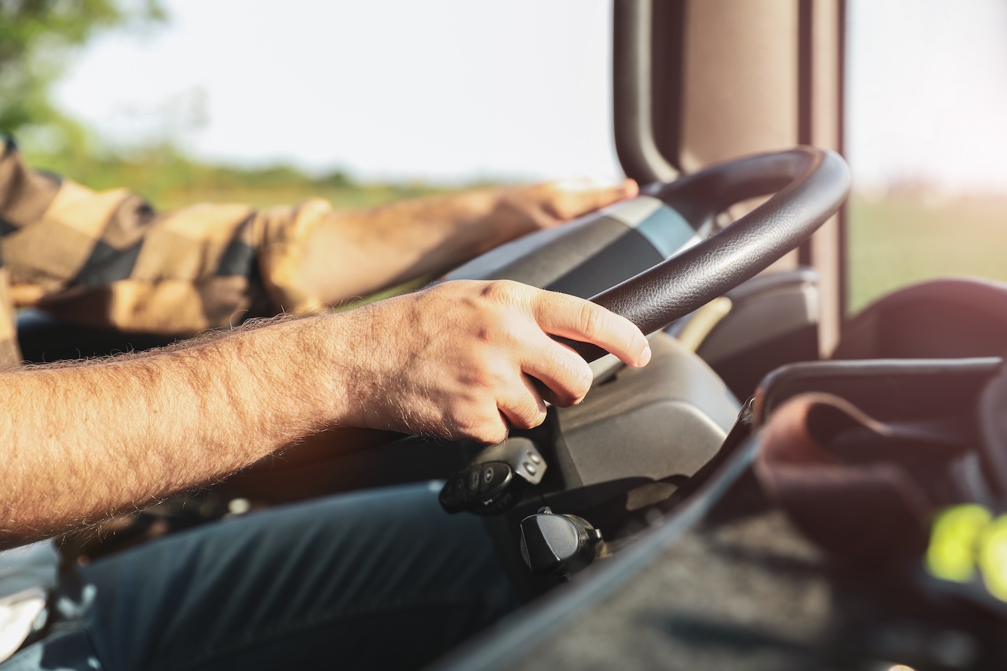 Young man driving modern truck