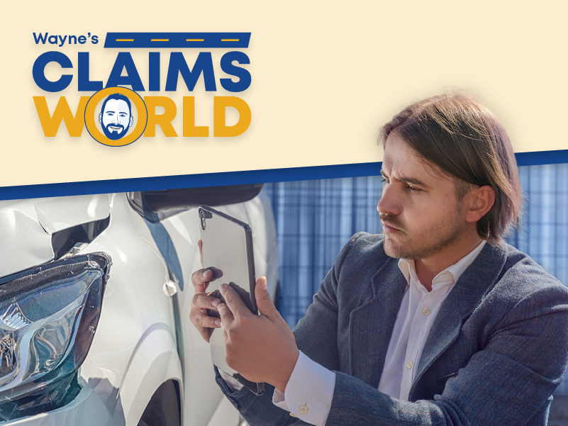 Wayne’s Claims World logo, A man in a suit using his phone to take a photo of a damaged car.