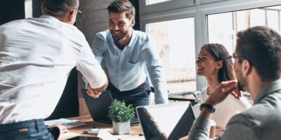 Two businessmen shaking hands during a meeting