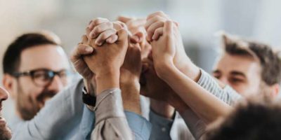 people holding hands in air