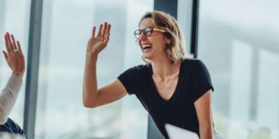 woman high fiving her team