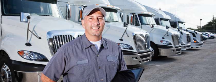 man in front of tractor trailers
