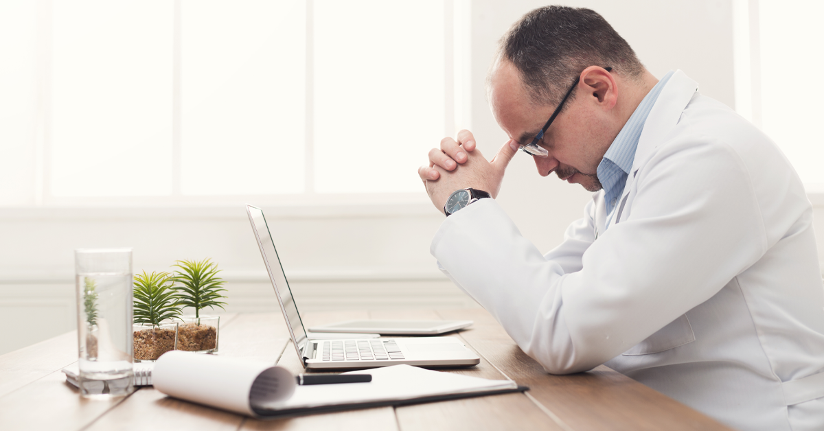 Man with his head down