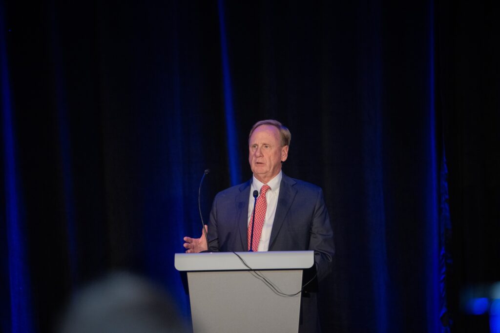 Photo of the Geof McKernan making his award acceptance speech at a podium