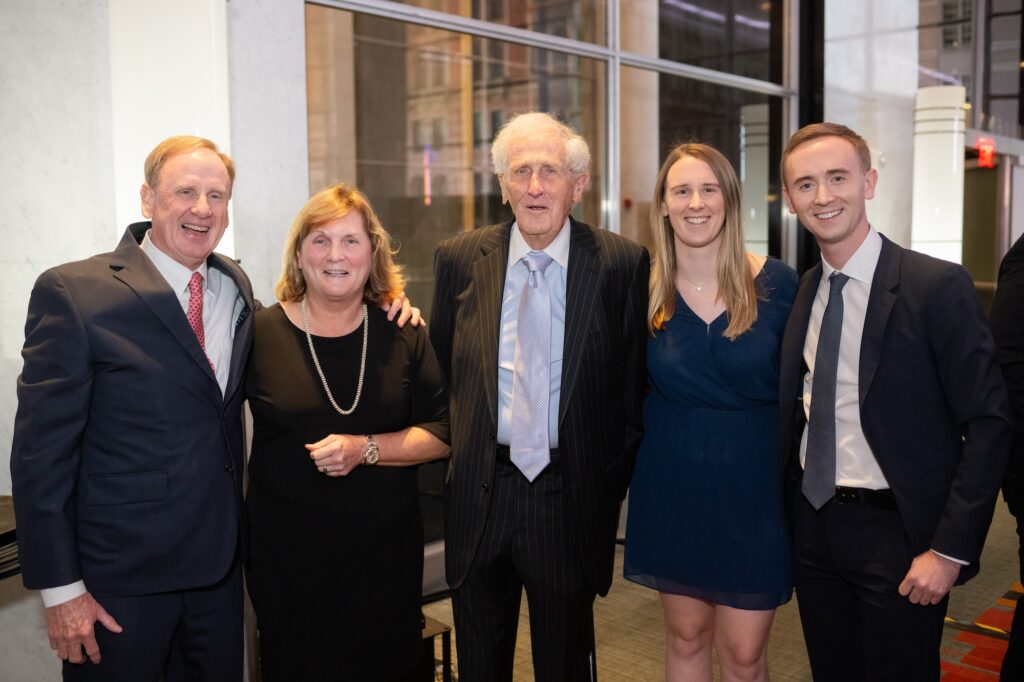 Photo of Geof McKernan posing with his family