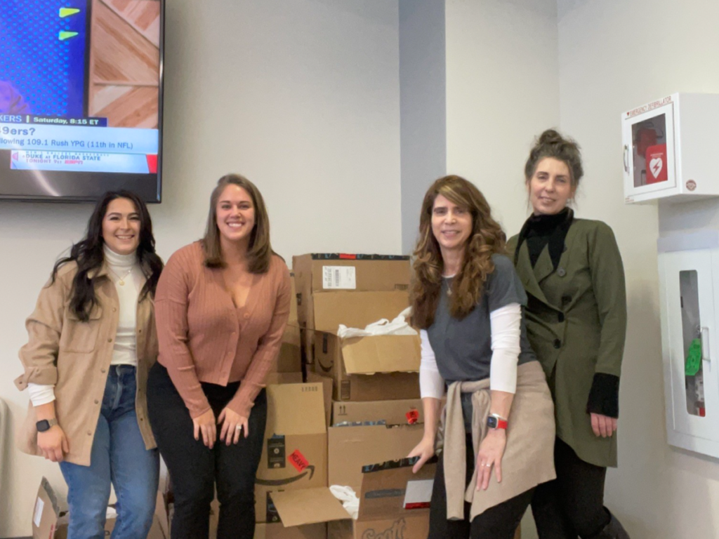Photo of several people volunteering at the NSM office