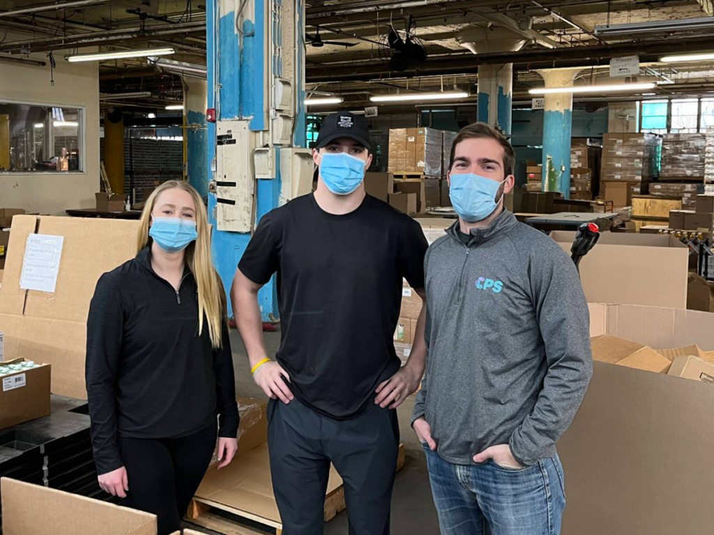 Photo of several people volunteering at a food bank